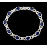 Silver cubic zirconia and blue stone set bracelet