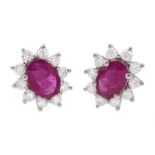 Pair of 18ct white gold oval ruby and round brilliant cut diamond cluster stud earrings