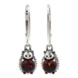 Pair of silver amber hedgehog pendant stud earrings