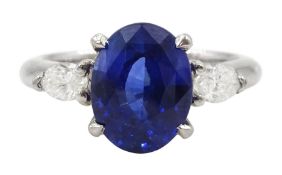 Platinum three stone oval cut sapphire and pear cut diamond ring