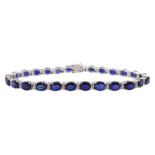 18ct white gold oval cut sapphire and round brilliant cut diamond bracelet