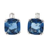 Pair of 9ct white gold cushion cut London blue topaz and tapered baguette cut diamond stud earrings