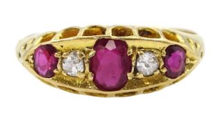 Early 20th century 18ct gold five stone oval cut ruby and old cut diamond ring