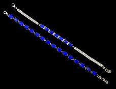 Silver oval cut lapis lazuli bracelet and one other silver lapis lazuli and white zircon bracelet