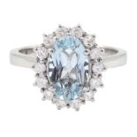 18ct white gold oval cut aquamarine and round brilliant cut diamond cluster ring