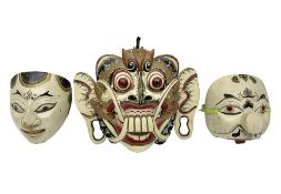 Three carved wooden Balinese topeng masks