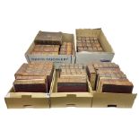Thirty six volumes of Encyclopaedia Britannica with gold tooled red leather spines in various editio