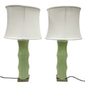 Pair of table lamps in the form of bamboo upon a square base