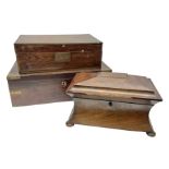 Mahogany tea caddy of sarcophagus form the hinged lid enclosing twin tea compartments