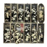 Thirteen 20th century chinese lacquered wall plaques