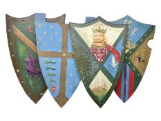 Four decorative painted wooden wall mounting shields