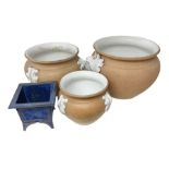 Three large jardinieres with terracotta to the outside and white glaze decoration together with anot