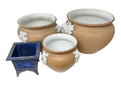 Three large jardinieres with terracotta to the outside and white glaze decoration together with anot