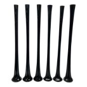 Six tall tapering cylindrical black glass vases