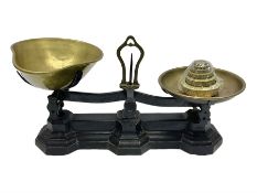 Black painted and brass kitchen balance scales with graduated set of brass weights