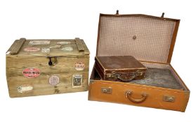 Three vintage suitcases of various sizes