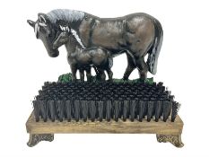 Cast iron horse and foal boot brush on wooden base