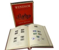 Queen Victoria and later Great British stamps housed in a red 'Windsor' album
