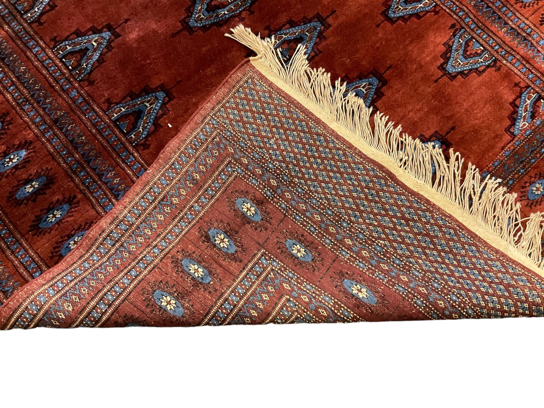 Persian Bokhara burnt amber ground rug - Image 5 of 6