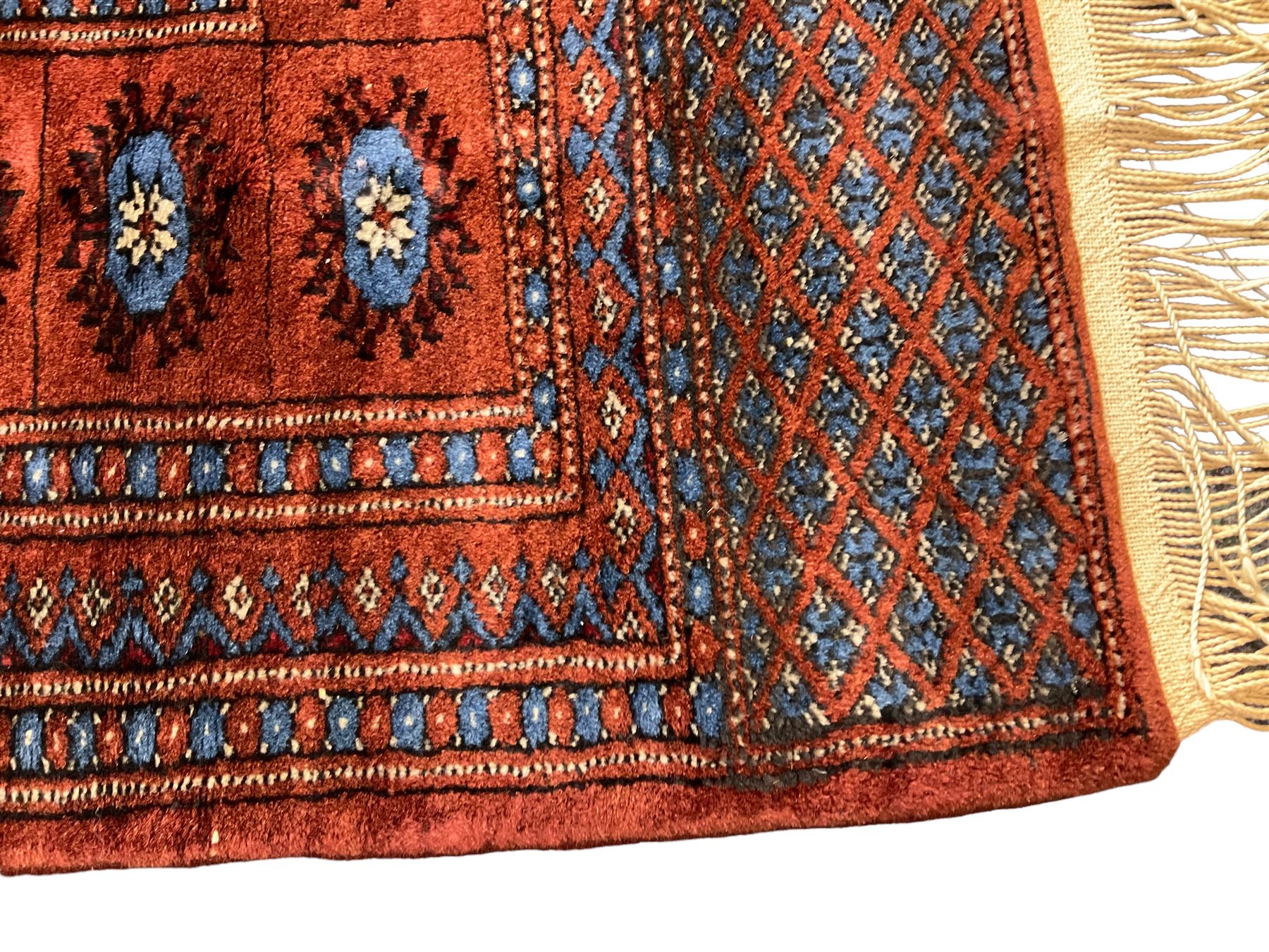 Persian Bokhara burnt amber ground rug - Image 4 of 6