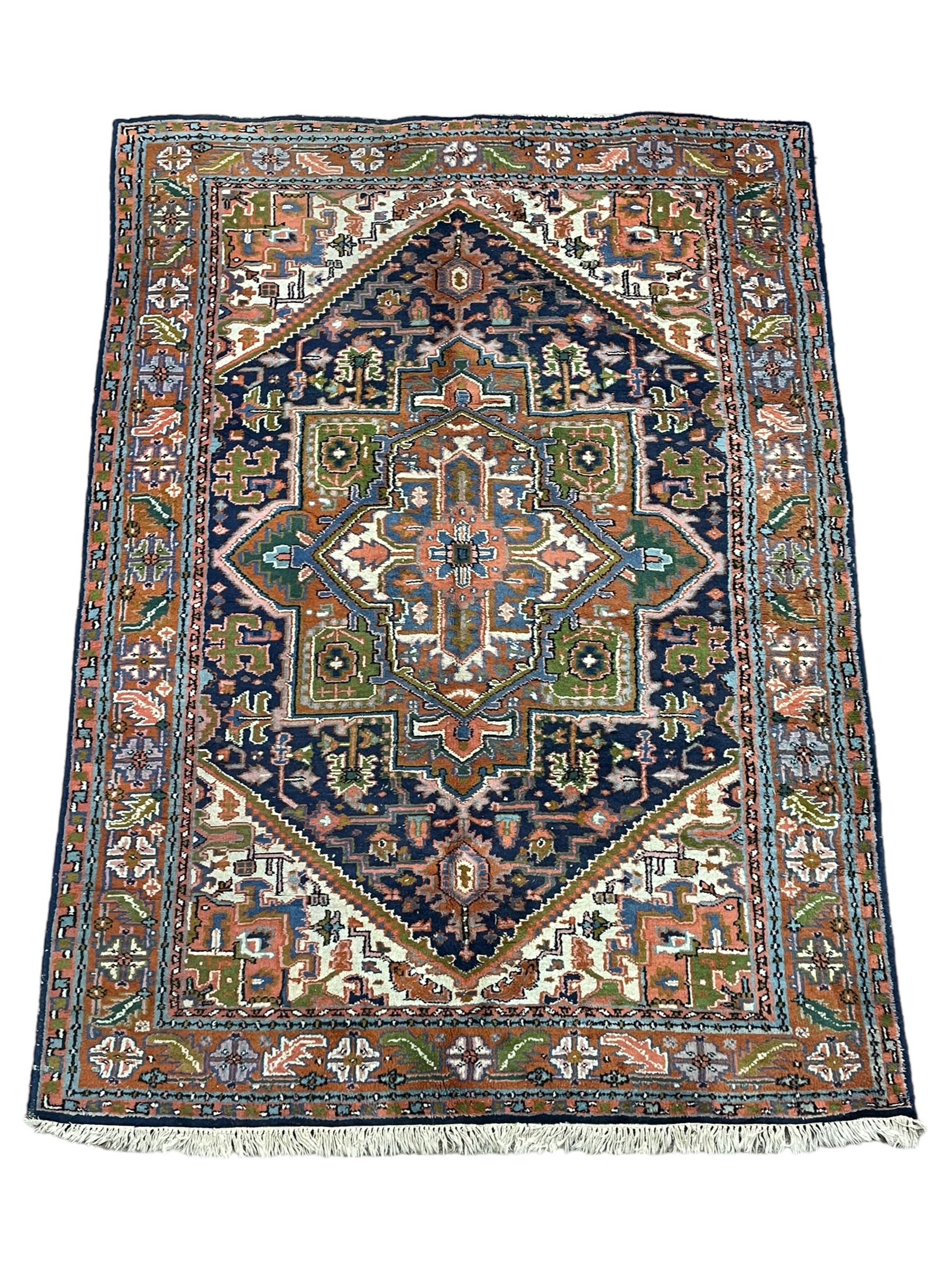 Persian Heriz indigo and rust ground rug