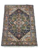 Persian Heriz indigo and rust ground rug
