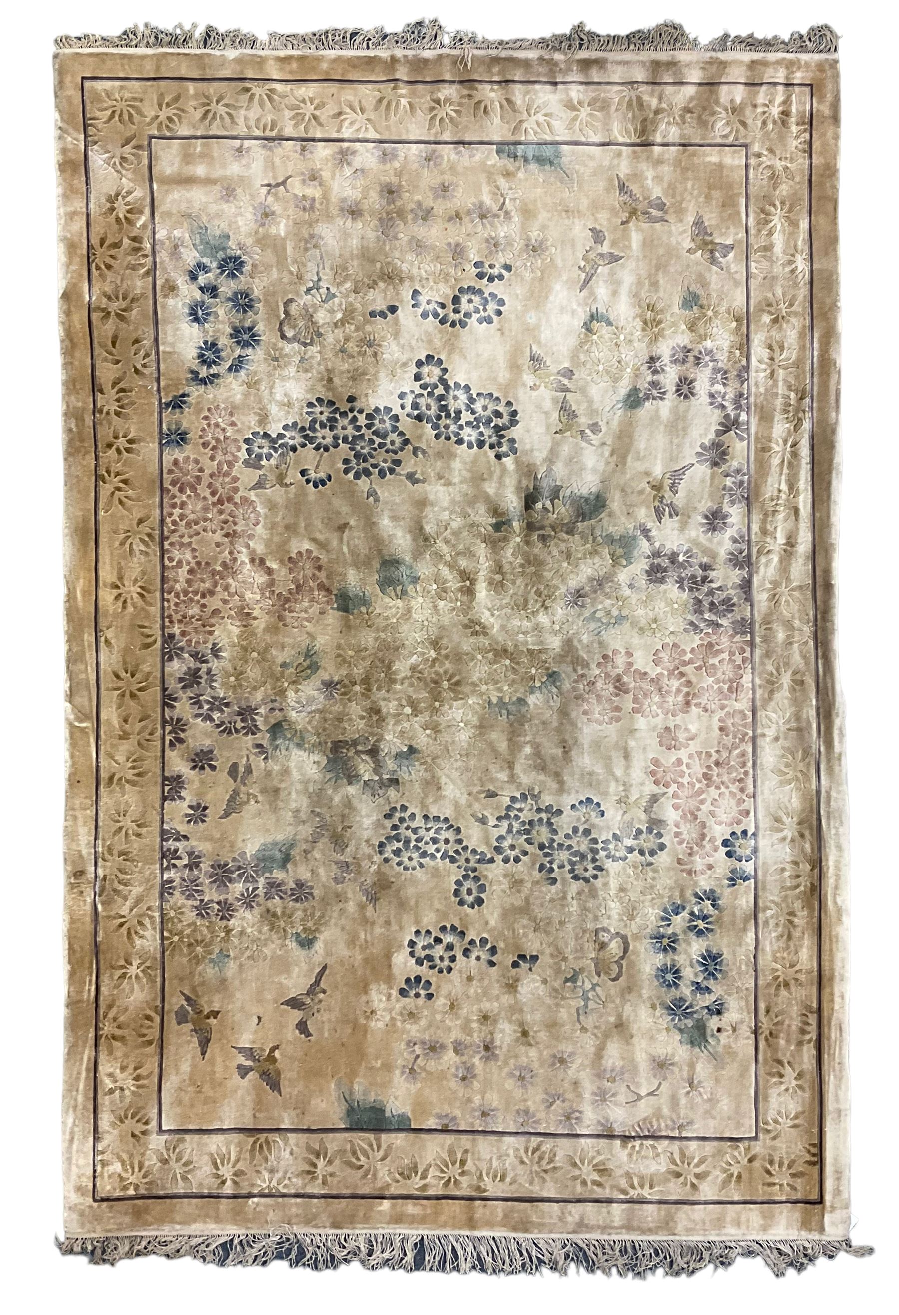 Fine Chinese silk ivory ground rug