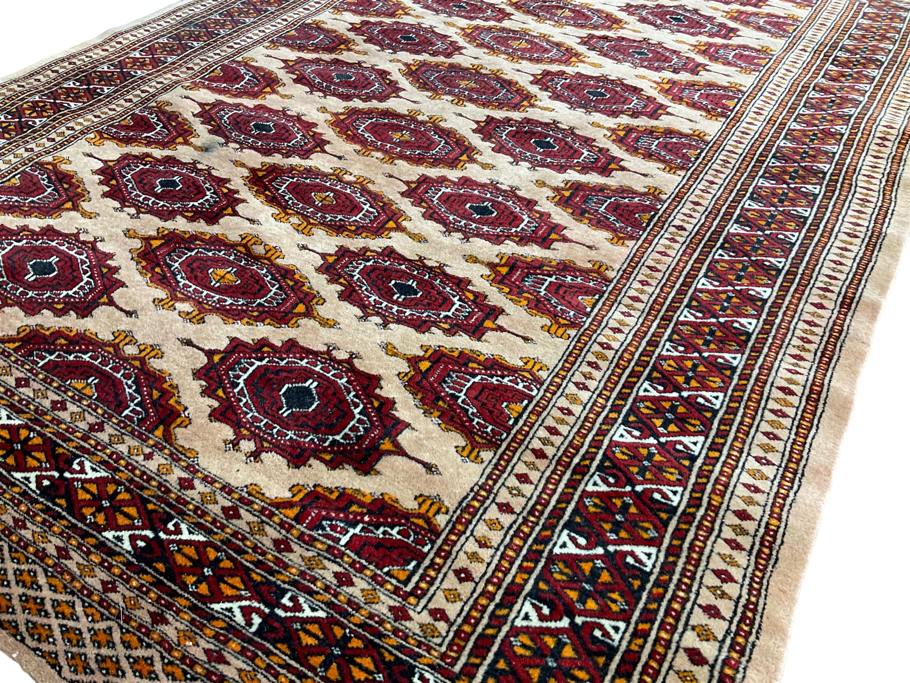 Persian Bokhara peach ground rug - Image 3 of 5