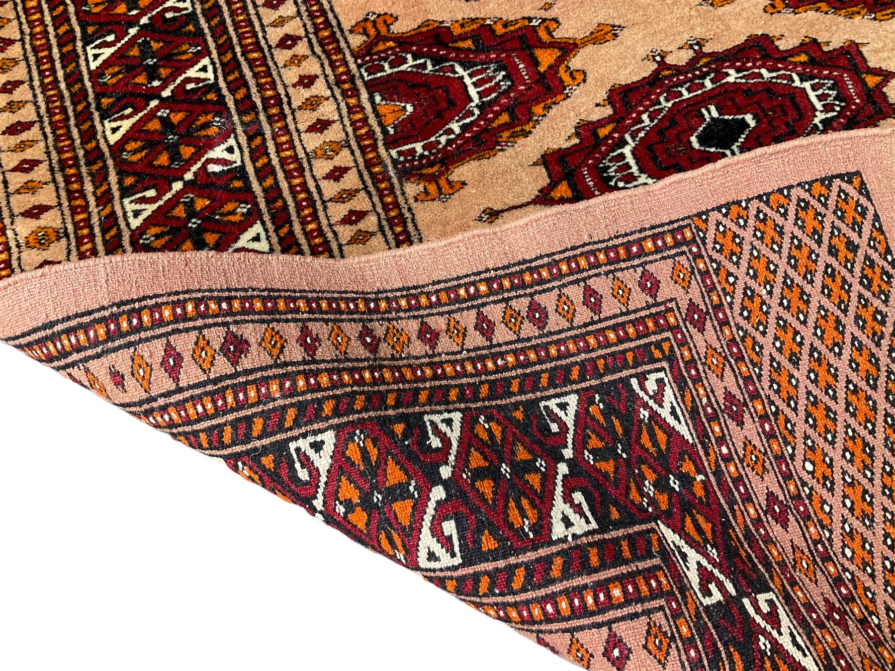 Persian Bokhara peach ground rug - Image 5 of 5