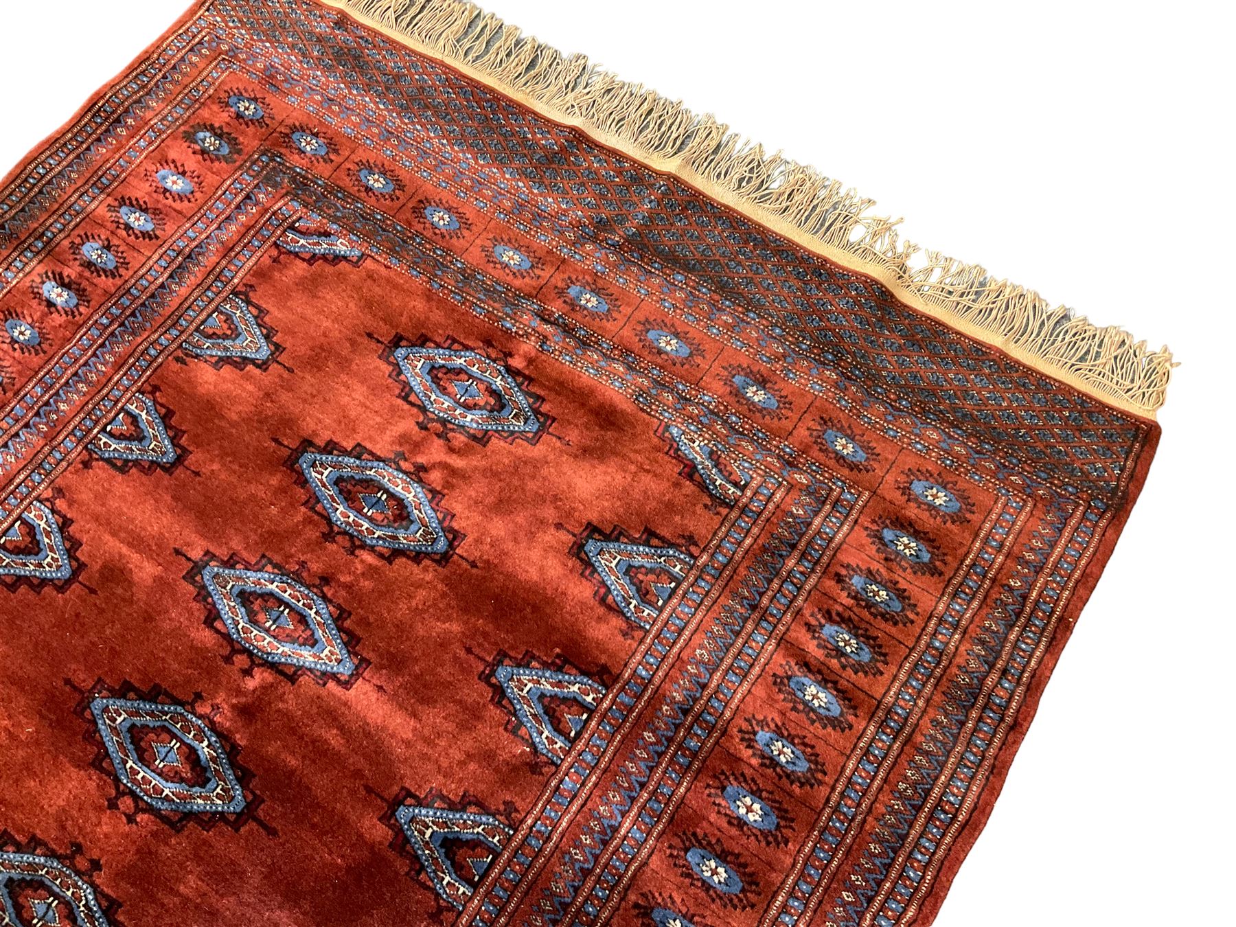 Persian Bokhara burnt amber ground rug - Image 3 of 6