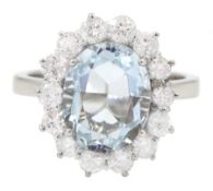 18ct white gold oval cut aquamarine and round brilliant cut diamond cluster ring