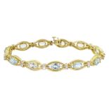 14ct gold oval cut aquamarine and round brilliant cut diamond link bracelet