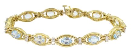 14ct gold oval cut aquamarine and round brilliant cut diamond link bracelet