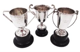 Three small silver twin handled trophy cups