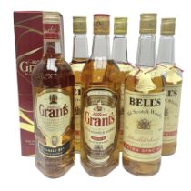 Four bottles of Bells extra special blended whisky