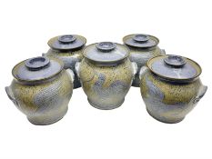 John Egerton (c1945-): set of five studio pottery stoneware twin handled jars with covers