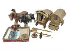 Ceramic horses with wooden caravans