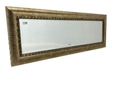 Rectangular wall mirror in gilt famed