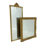 Rectangular gilt framed wall mirror with scrolled foliate cartouche (42cm x 118cm); and a swept gilt