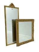 Rectangular gilt framed wall mirror with scrolled foliate cartouche (42cm x 118cm); and a swept gilt