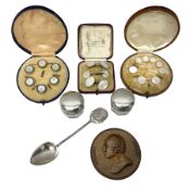 Three cased sets of dress buttons