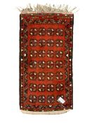 Small Persian red ground rug