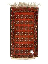 Small Persian red ground rug