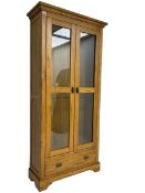 Tall oak display cabinet