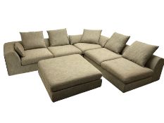 Contemporary corner sofa upholstered in grey fabric (310cm x 282cm); with matching rectangular foots