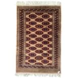 Persian Bokhara peach ground rug