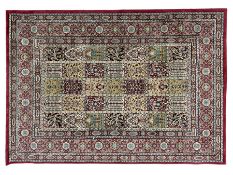Persian design crimson ground garden rug