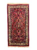 Small Persian red ground rug
