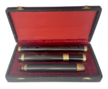 Irish three-piece hardwood flute with brass mounts; in fitted hard carrying case