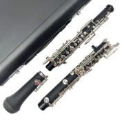 Modern three-piece oboe with full mechanism; in fitted hard case and outer carrying case